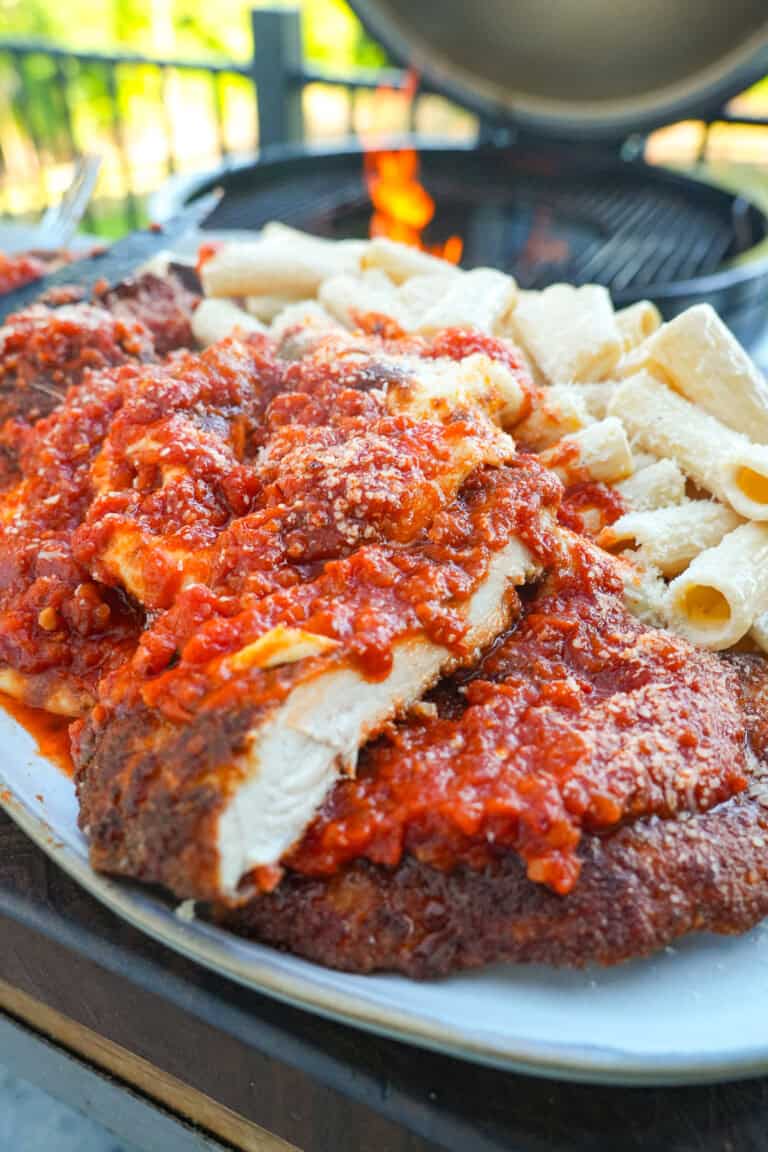A close up of the Spicy Chicken Park, sliced into strips and served with pasta.