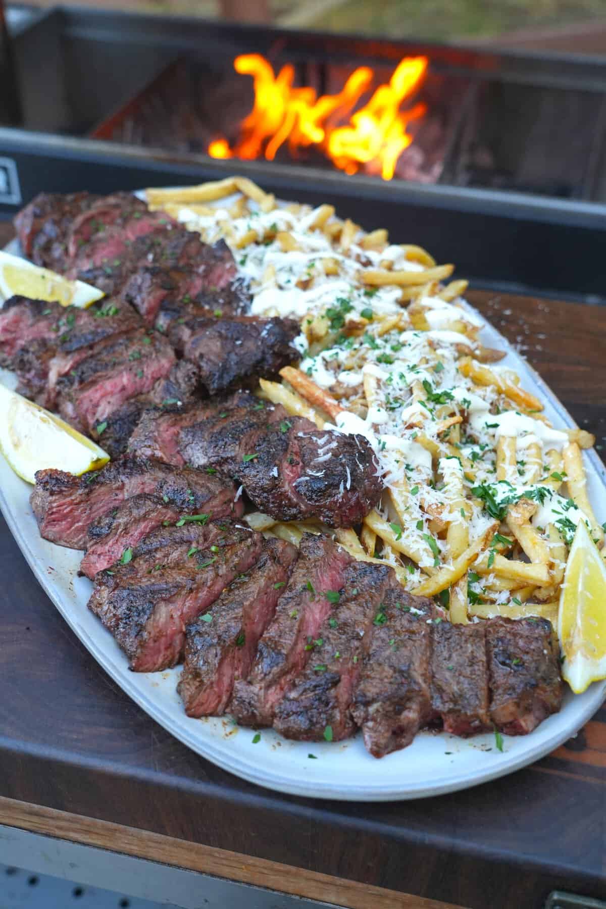 The finished steak and truffle fries dish is an epic meal waiting to be devoured.