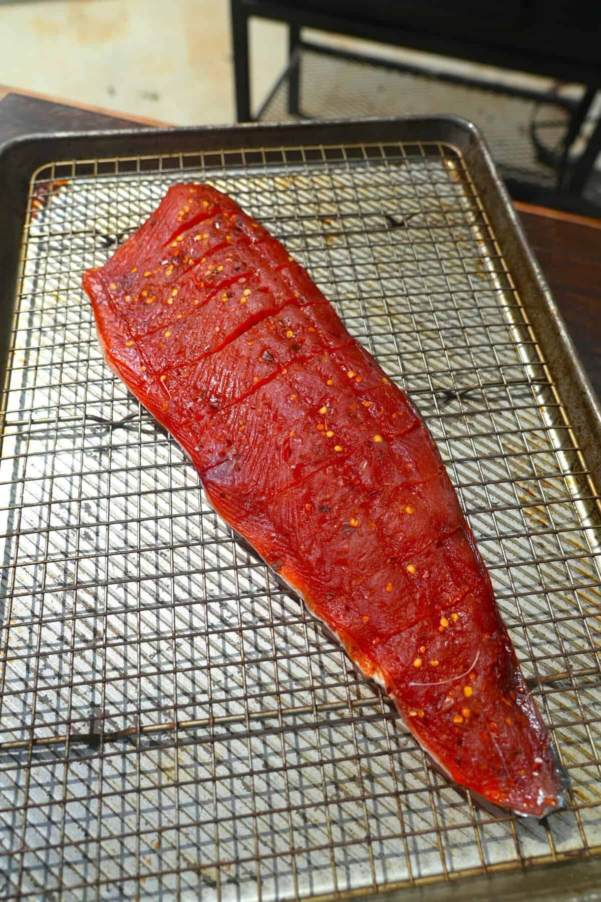 The dried fish after spending time in the smoker, before the glaze.