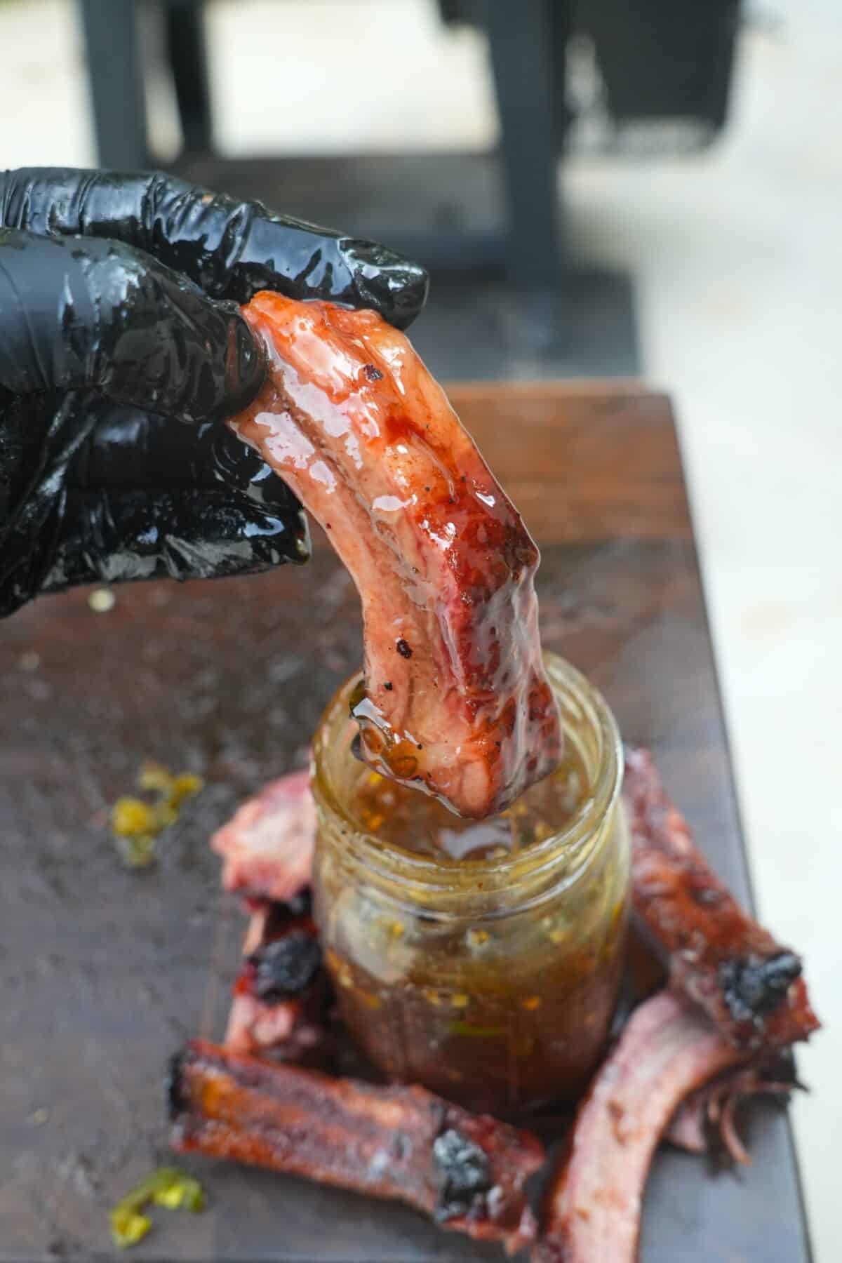 The honey jalapeno rib is dipped in the hot honey sauce.