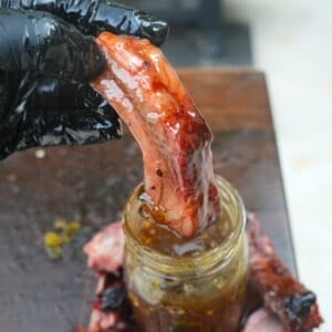 The honey jalapeno rib is dipped in the hot honey sauce.