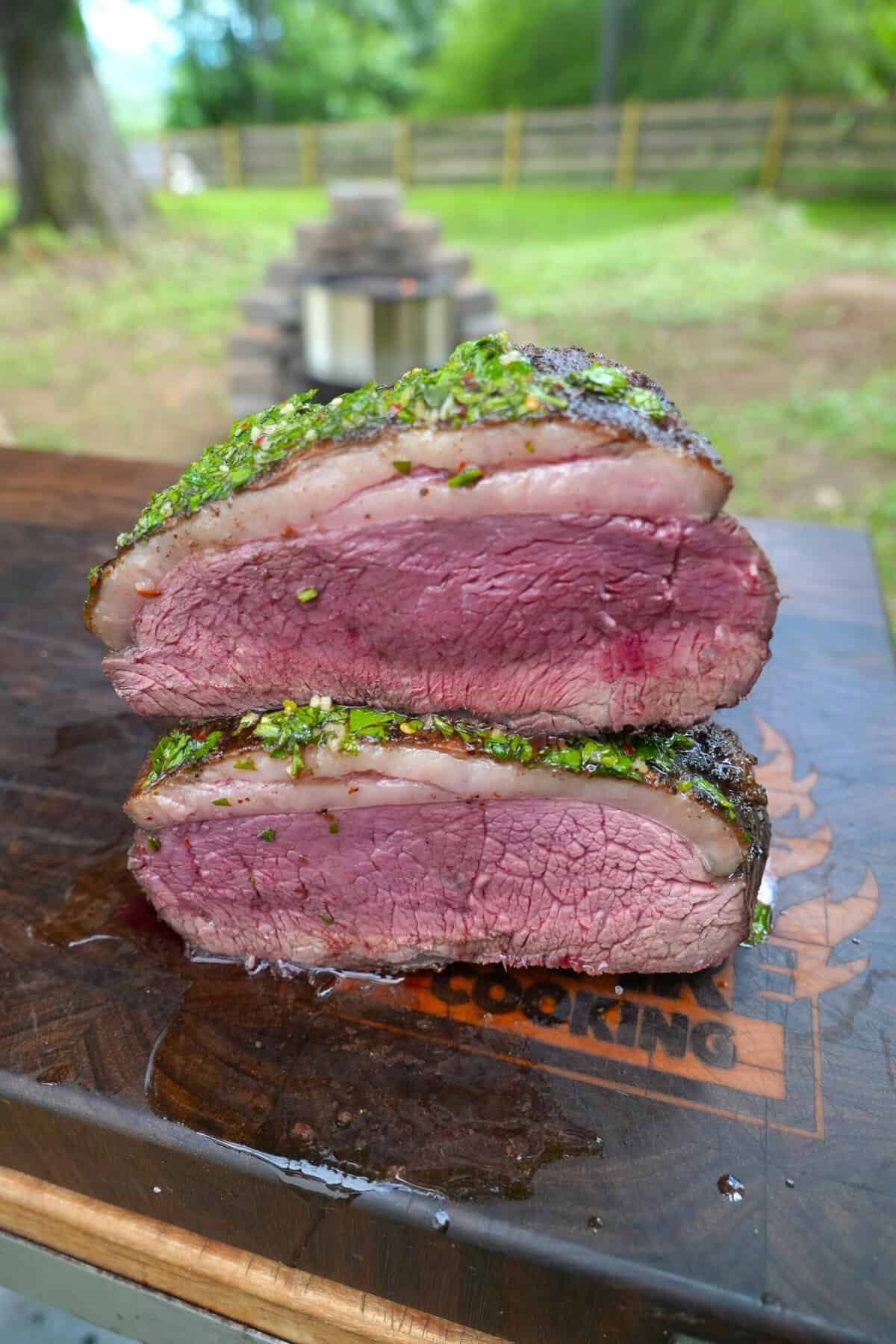 Grilled picanha, cut in half to show texture and rareness