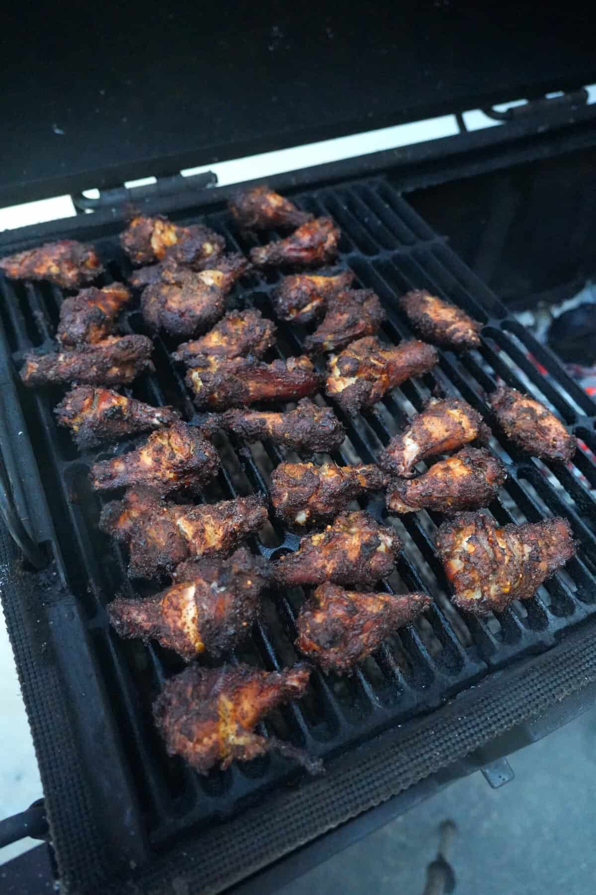 The wings are smoked and browning to perfection.