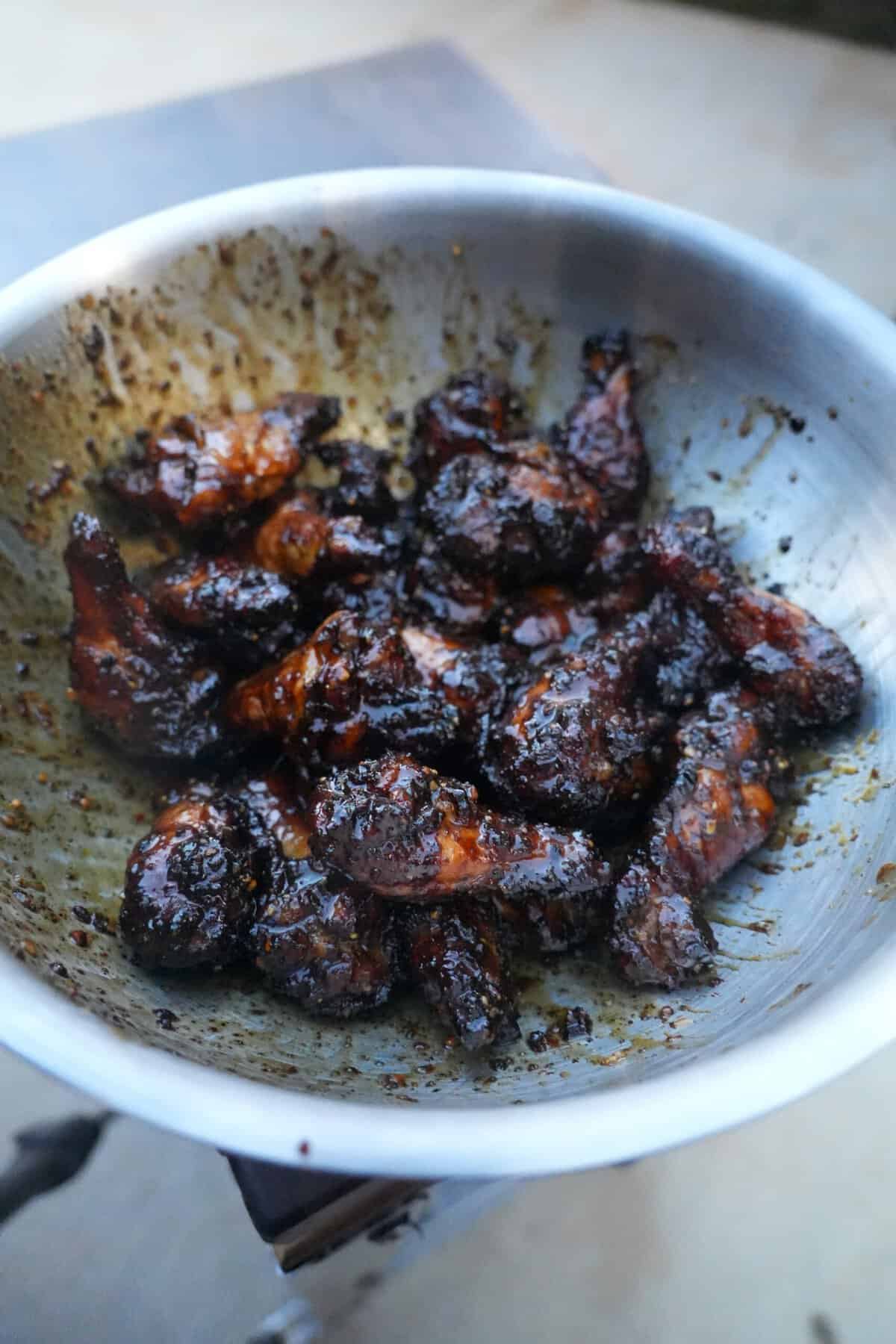 Tossing the Honey Lemon Pepper Wings with the amazing sauce.