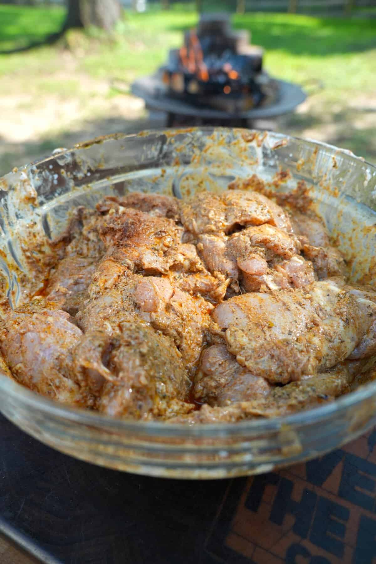 Marinating boneless, skinless chicken thighs in yogurt and spices