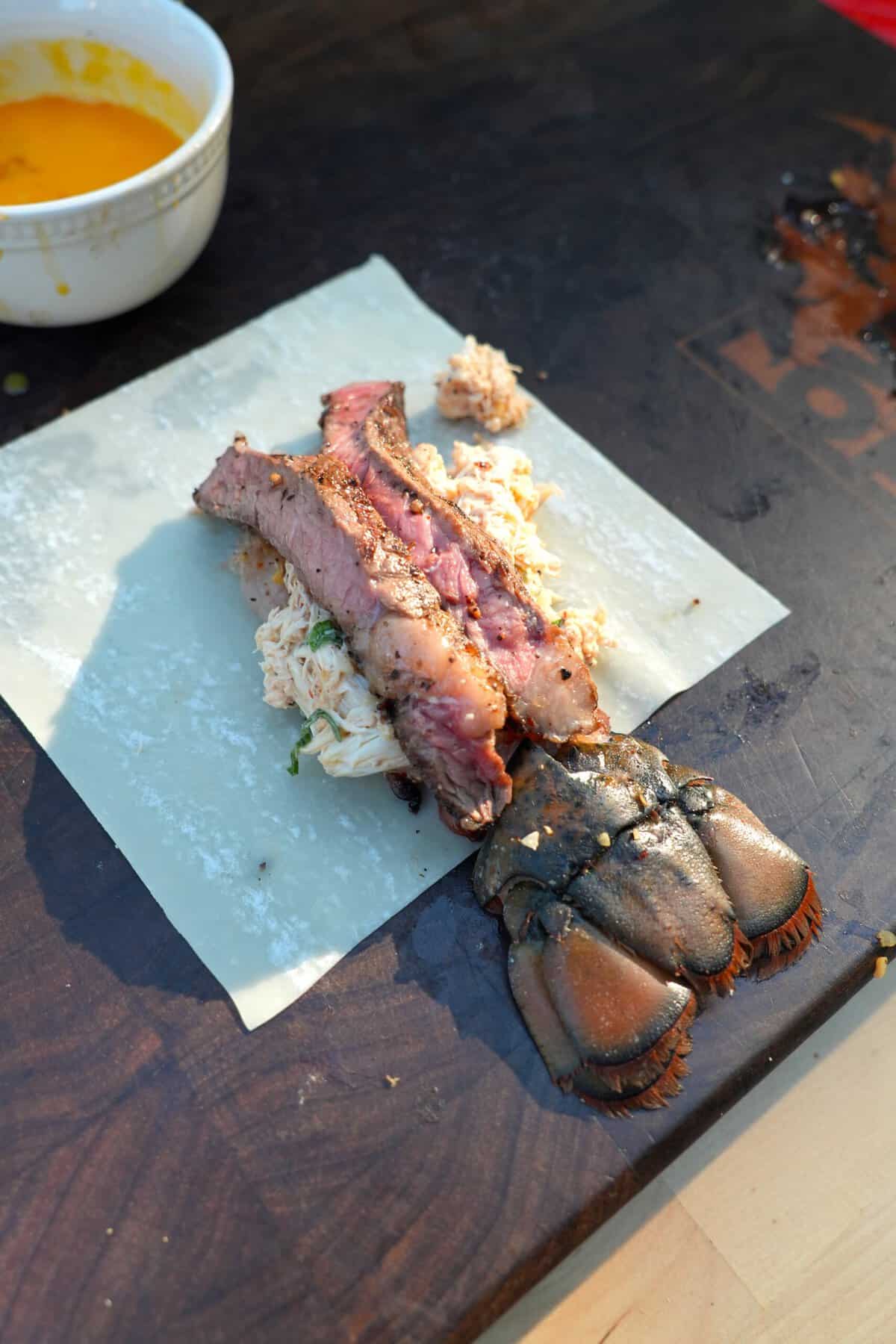 Building the lobster tail stuffing of the egg roll with mayonnaise, panko breadcrumbs, scallions and seasoning