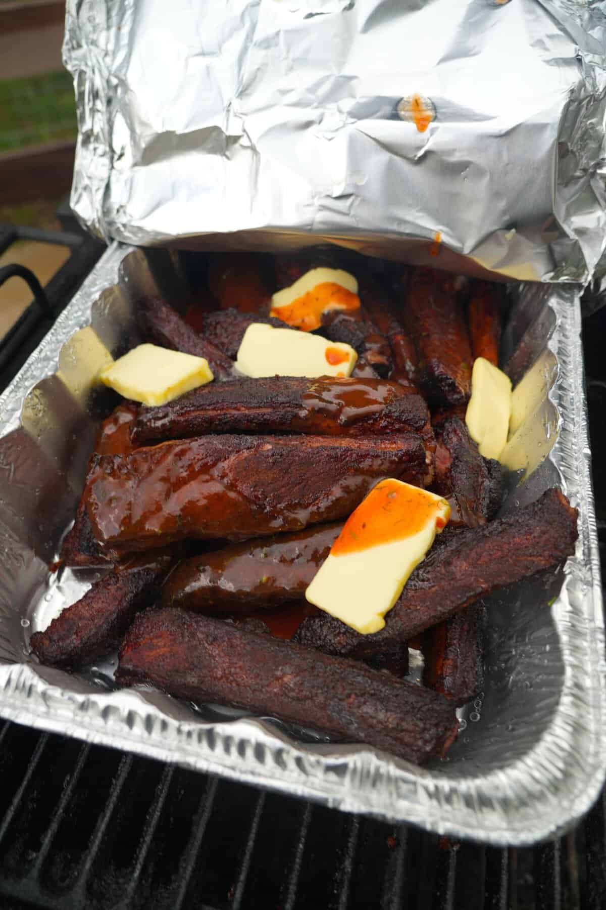 The secret weapon for this Dill Pickle Smoked Ribs recipe is the buttery finish.