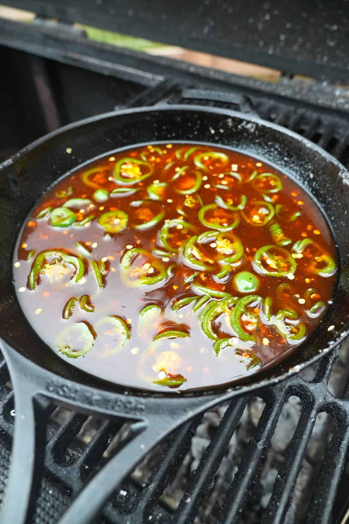 This is a shot of the glaze simmering in the cast iron pan over the hot fire.