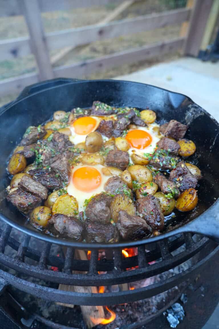 An alternative shot of the steak and eggs with honey cajun butter drizzled over the top.