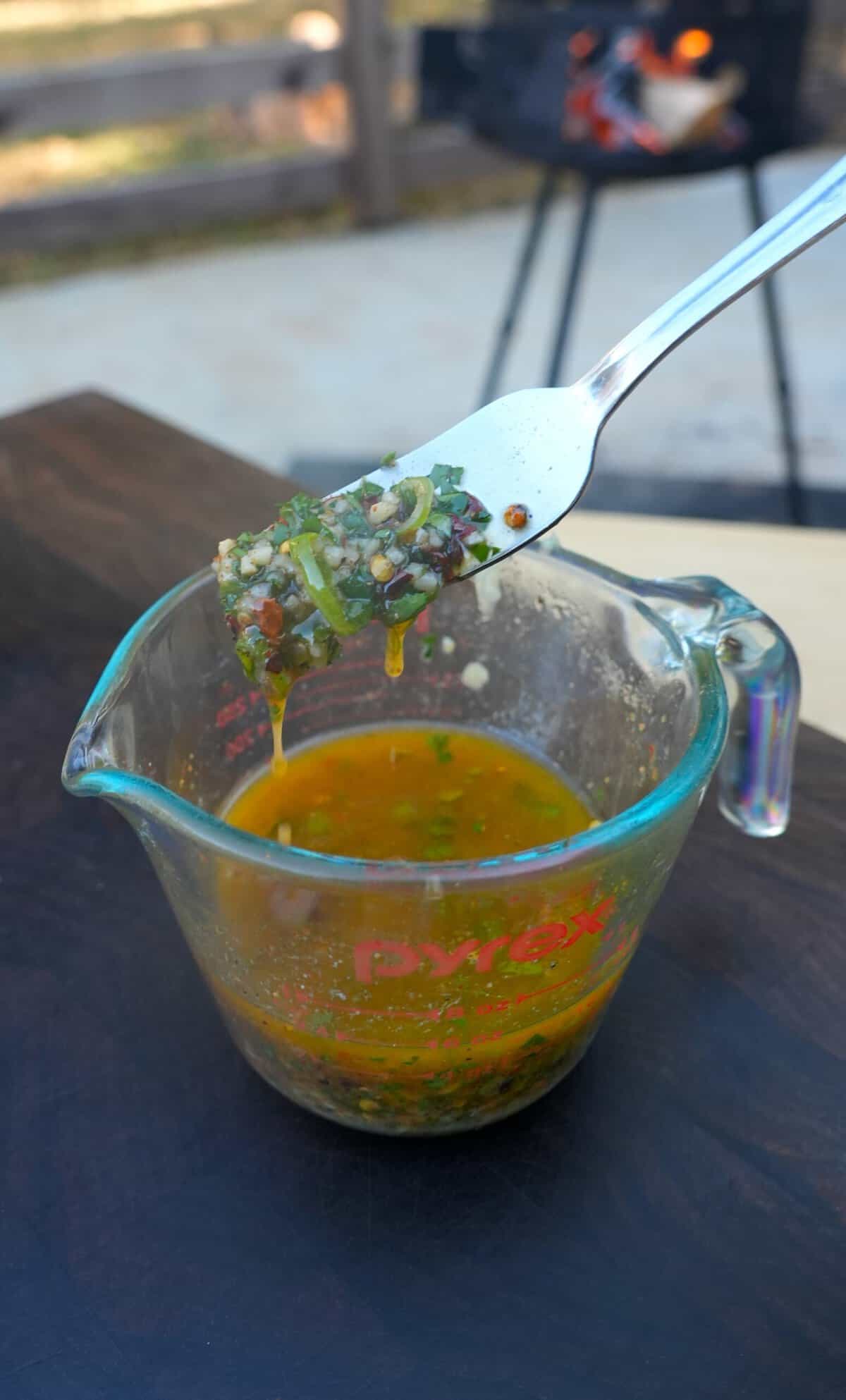 The honey cajun butter is prepped in a Pyrex measuring cup.