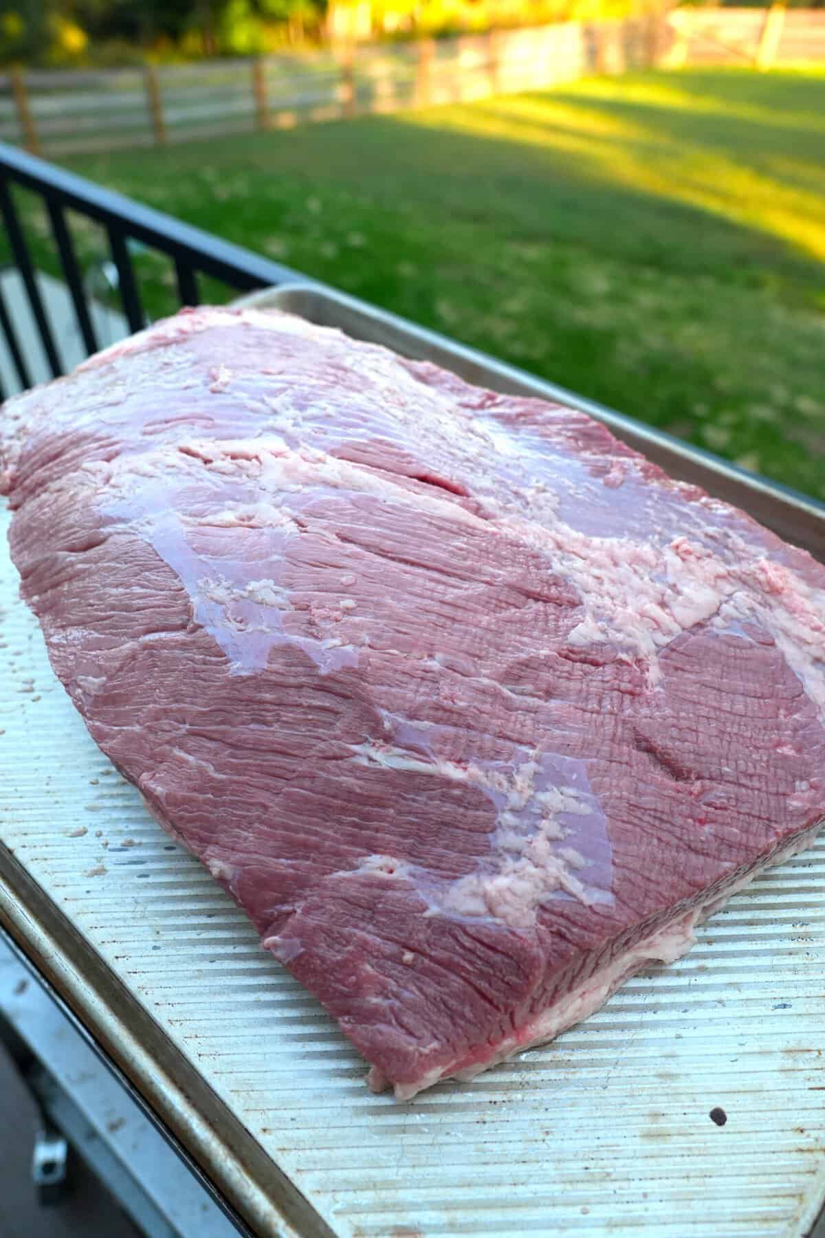 Trimming the whisky injected brisket is all part of the art of making the best smoked brisket possible